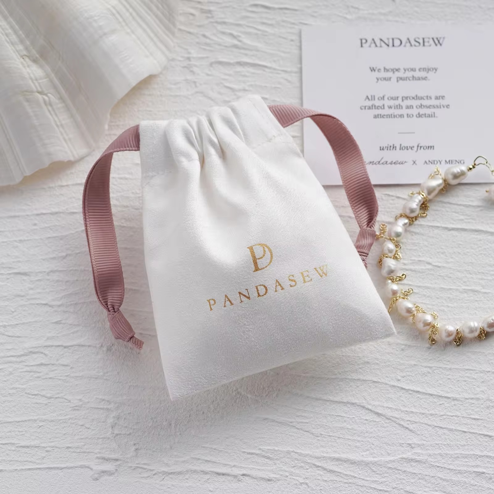 Luxury Bags Logo - Luxe suède trekkoordtasje met roze lintjes