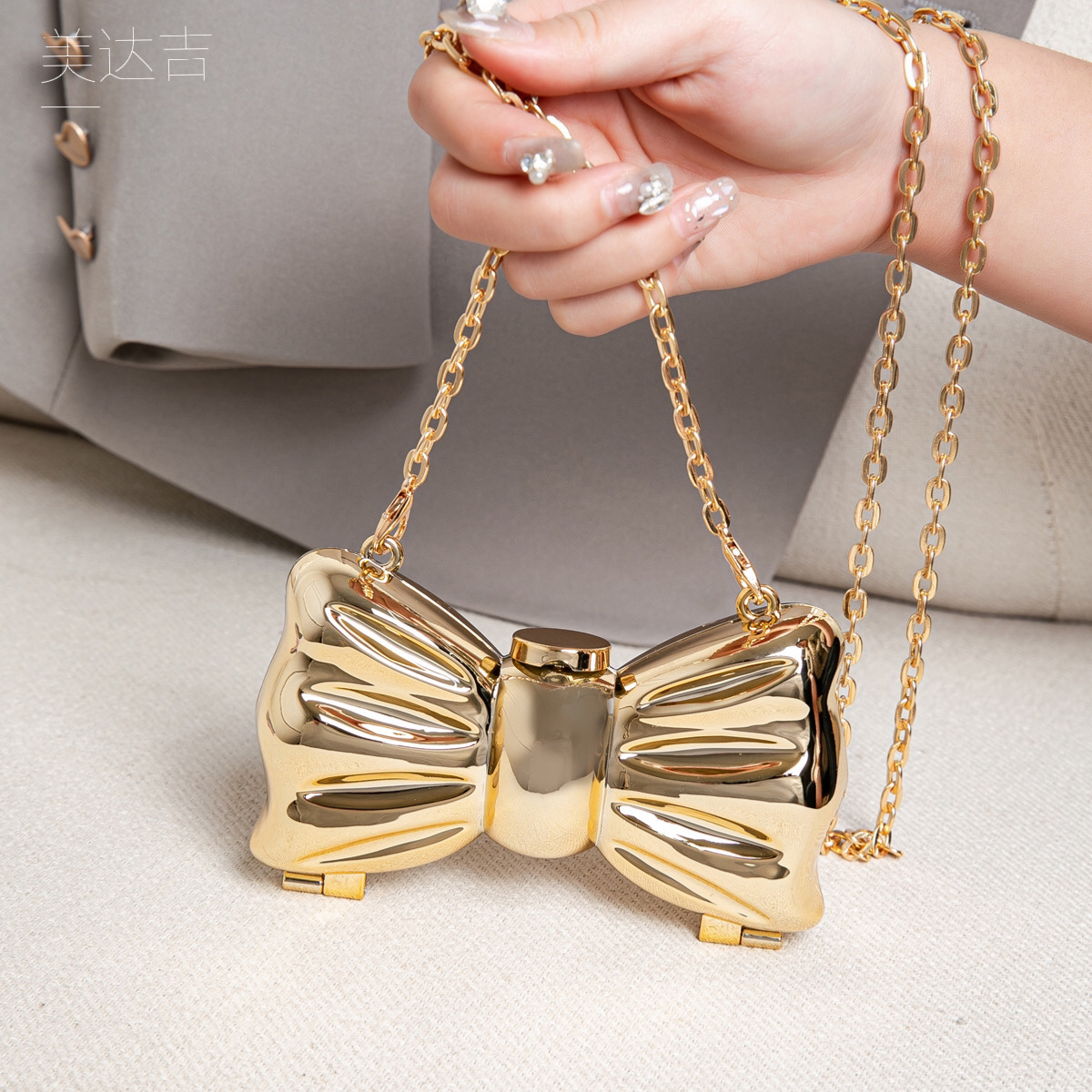 Glanzende gouden metalen strik - Luxury Bags Trending recensie en prijs