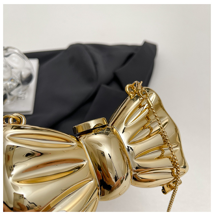 Glanzende gouden metalen strik - Luxury Bags Trending recensie en prijs