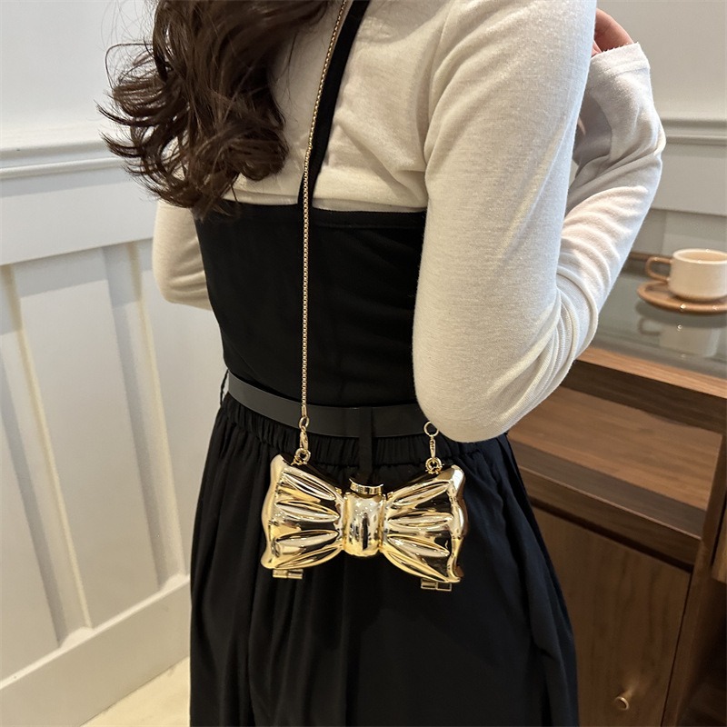 Glanzende gouden metalen strik - Luxury Bags Trending recensie en prijs